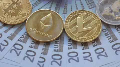 Various crypto coins placed on 20 euro notes and spinning. Stock Footage 99567951