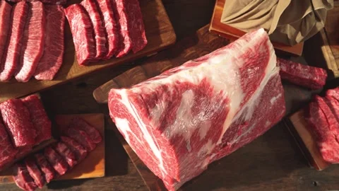 Various Cuts of Raw Meat Slowly Moving on Table Top View Stock Footage 335257000