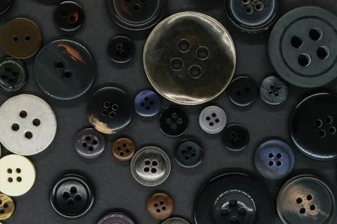Various dark clothes buttons background Stock Photos