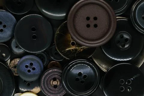 Various dark clothes buttons background Stock Photos