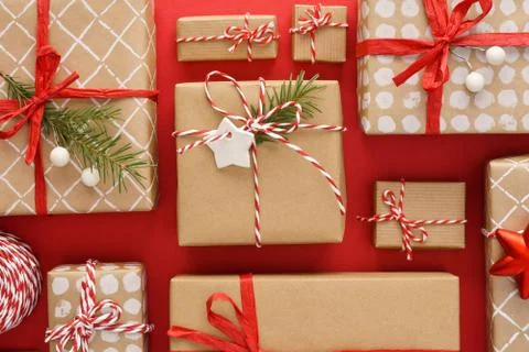 Various decorated gift boxes on red background. Stock Photos