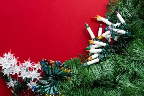 Various decorations for the Christmas tree on a red background with place for Foto stock