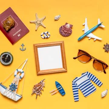 Various decorative nautical items, plane, sailboat, sunglasses, passport and  Stock Photos