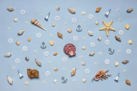 Various decorative nautical items, seashells, sea stars and miniature toys on Stock Photos