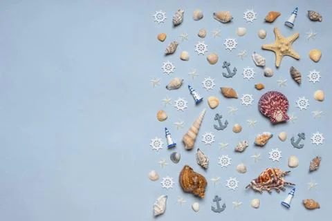 Various decorative nautical items, seashells, sea stars and miniature toys on Stock Photos