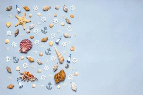 Various decorative nautical items, seashells, sea stars and miniature toys on Stock Photos