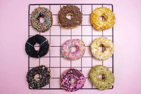Various delicious donuts with different sprinkled decorations Stock Photos
