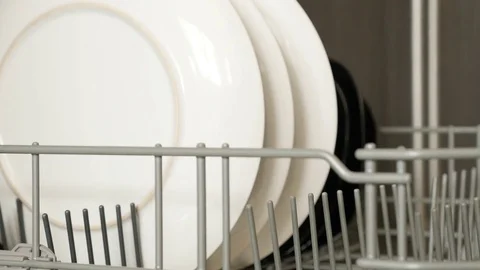 Various dishware inside built-in dishwasher Stock Footage 78697641
