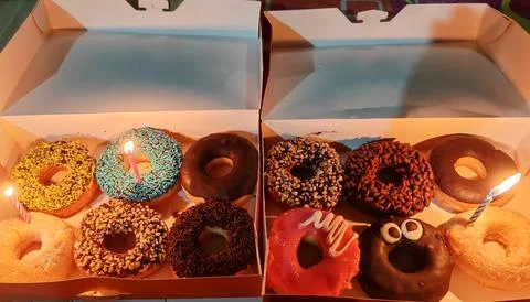 Various donuts of various flavors in one box Stock Photos