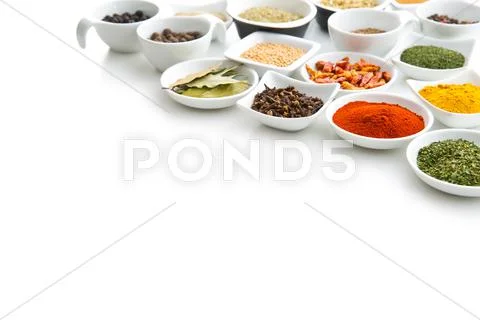 Various dried herbs and spices in bowl. Stock Photos