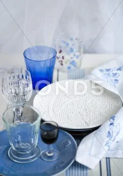 Various Drinking Glasses And Plates
