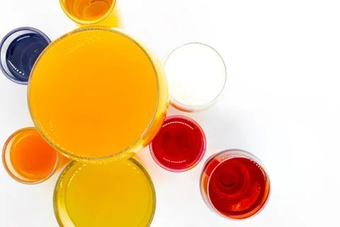 Various drinks in different shape glasses Stock Photos