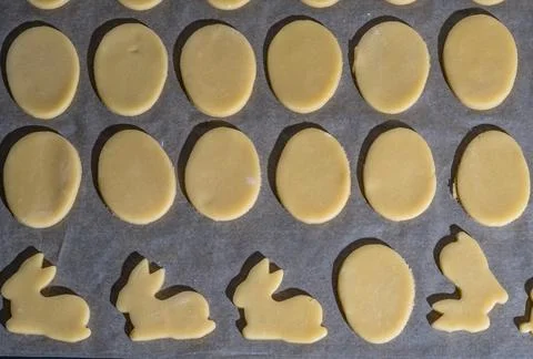 Various easter cookies on baking tray as background Stock-Fotos