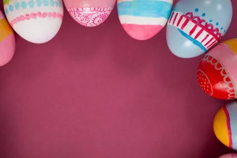 Various Easter eggs arranged on pink background 库存照片