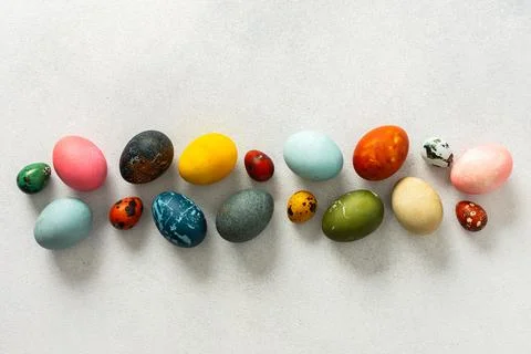 Various Easter eggs in vibrant colors and patterns are neatly arranged, sho.. Stock Photos