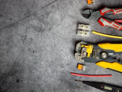 Various electrician tools on gray background with copy space. view from above Stock Photos