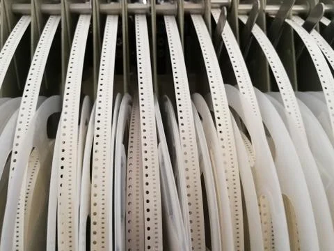 Various electronic component reels loaded in feeders of Pick and Place machin Stock Photos