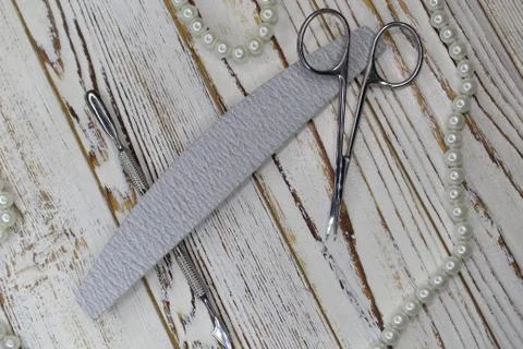 Various elegant manicure tools arranged on background. Stock Photos