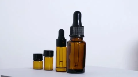 Various empty bottles of essential oils on a white background. Stock Footage 168397857