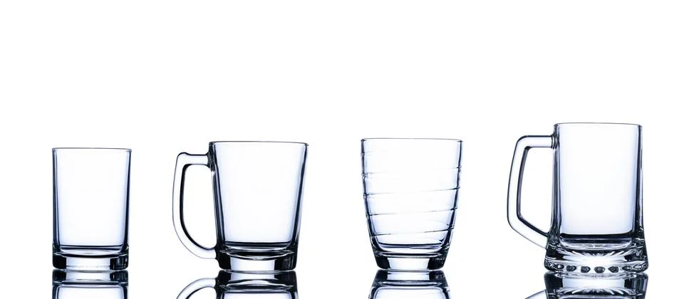 Various empty glasses set to hold water, juice or milk. Cocktail drink Househ Stock Photos