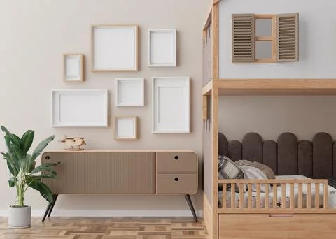 Various empty picture frames on beige wall in modern child's room. Mock up 스톡 일러스트