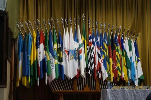 Various flags displayed indoors Stock Photos