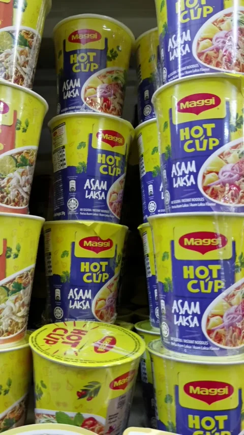 Various flavour of maggi hot cup at the supermarket Stock Footage 321677200