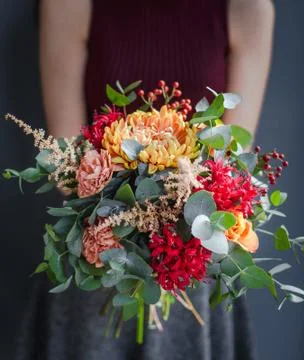 Various flowers bouquet on table Stock Photos