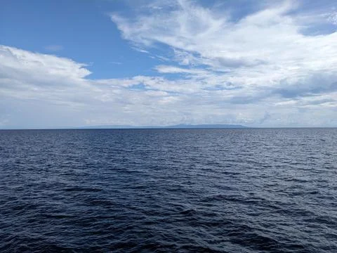 Various forms of clouds over the ocean Stock Photos