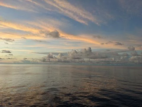 Various forms of clouds over the ocean Stock Photos