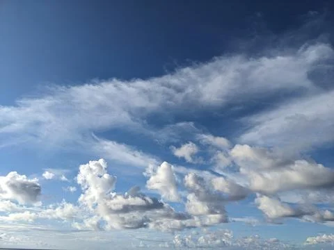 Various forms of clouds over the ocean Stock Photos