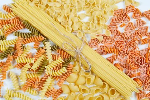 Various forms of pasta on white background Stock Photos