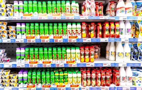 Various fresh dairy products ready for sale in a superstore Stock Photos