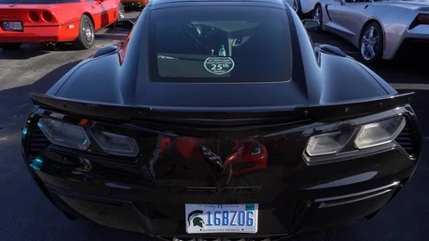 Various generations and trim levels of Corvettes parked, all viewed after Stock-Footage 122617576