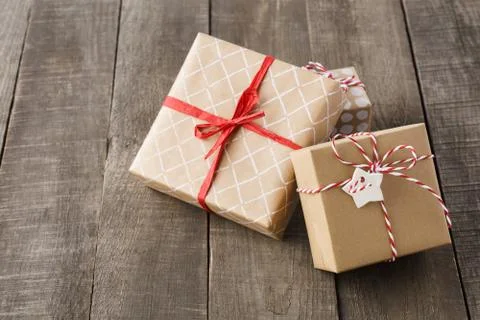 Various gift boxes decorated with red ribbon and twine. Stock Photos