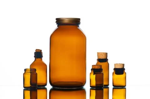 Various glass bottles on the white background Stock Photos