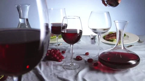 Various glasses of red wine on laid table Video stock 8570604