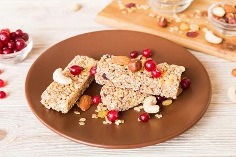 Various granola bars on table background. Cereal granola bars. Superfood brea Stock Photos