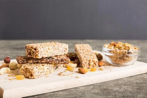 Various granola bars on table background. Cereal granola bars. Superfood brea Stock Photos