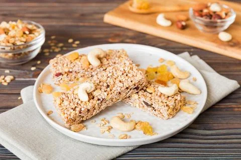 Various granola bars on table background. Cereal granola bars. Superfood brea Stock Photos