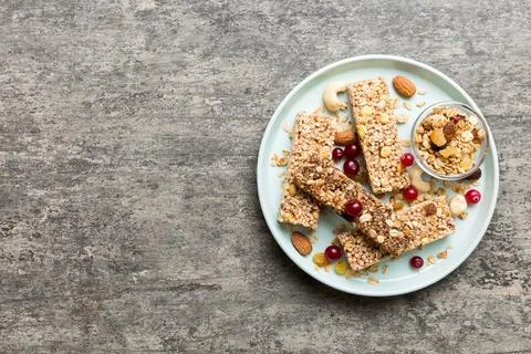Various granola bars on table background. Cereal granola bars. Superfood brea Stock Photos