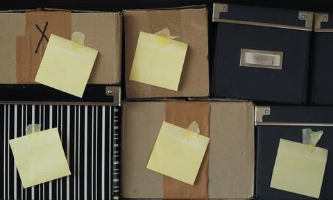Various grungy cardboard boxes with empty, blank adhesive labels,copy space Stock Photos