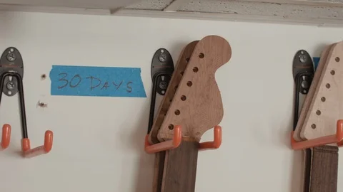 Various Guitar Necks Ready for Installation Stock Footage 126922796