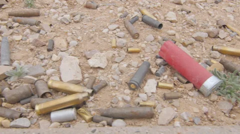 Various Gun Ammunition Shells on the Ground Stock Footage 60693709
