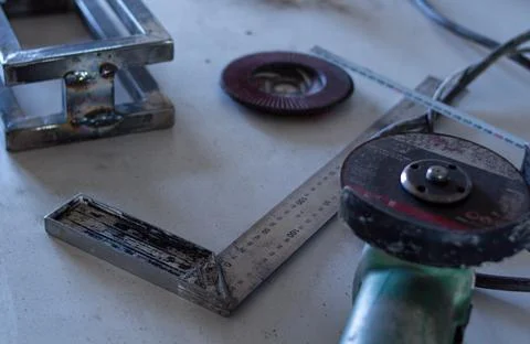 Various hand tools lie randomly on the table Stock Photos