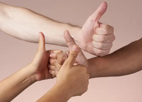 Various hands with thumbs-up Stock Photos