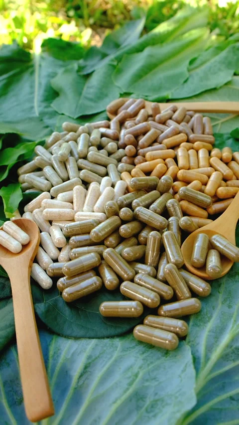 Various herbal supplement capsules. Selective focus. Stock Footage 318745754