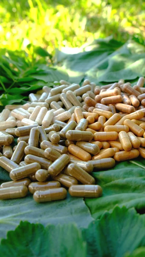 Various herbal supplement capsules. Selective focus. Stock Footage 318745797