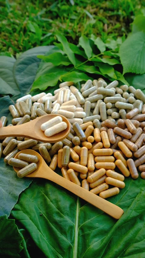 Various herbal supplement capsules. Selective focus. Stock Footage 318746014