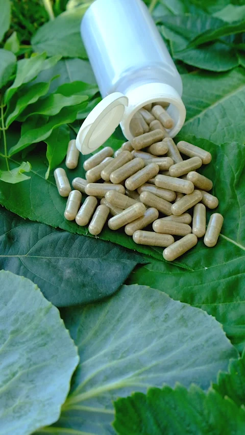Various herbal supplement capsules. Selective focus. Stock Footage 318746094